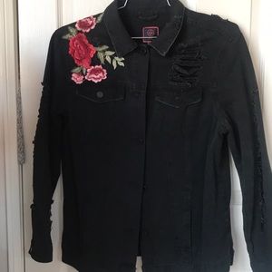 Distressed black embroidered jean jacket.